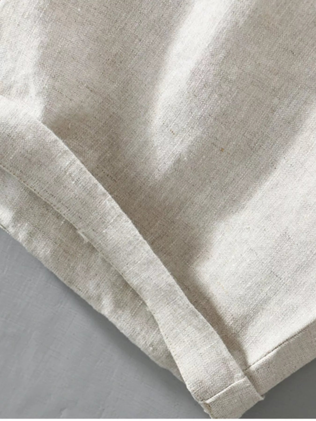 Close-up of white shorts hem and fabric