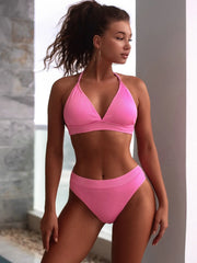 Pink ribbed halter bikini with triangle cups and matching high-cut bottoms, front view
