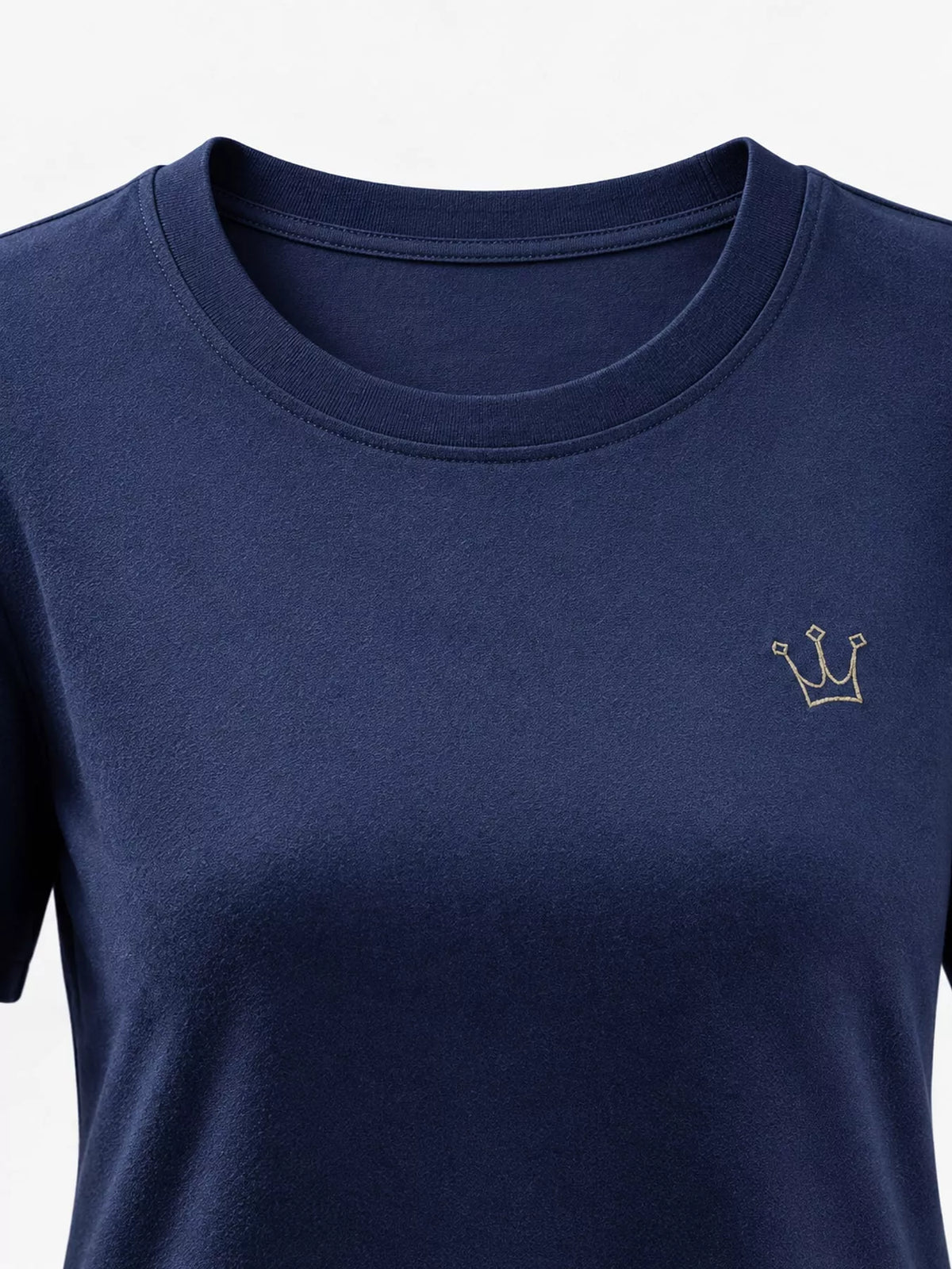 Close-up of navy T-shirt crew neckline and small crown emblem.