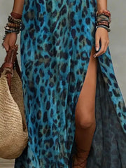 Close-up of the blue leopard-print maxi dress's high side slit and flowing skirt.