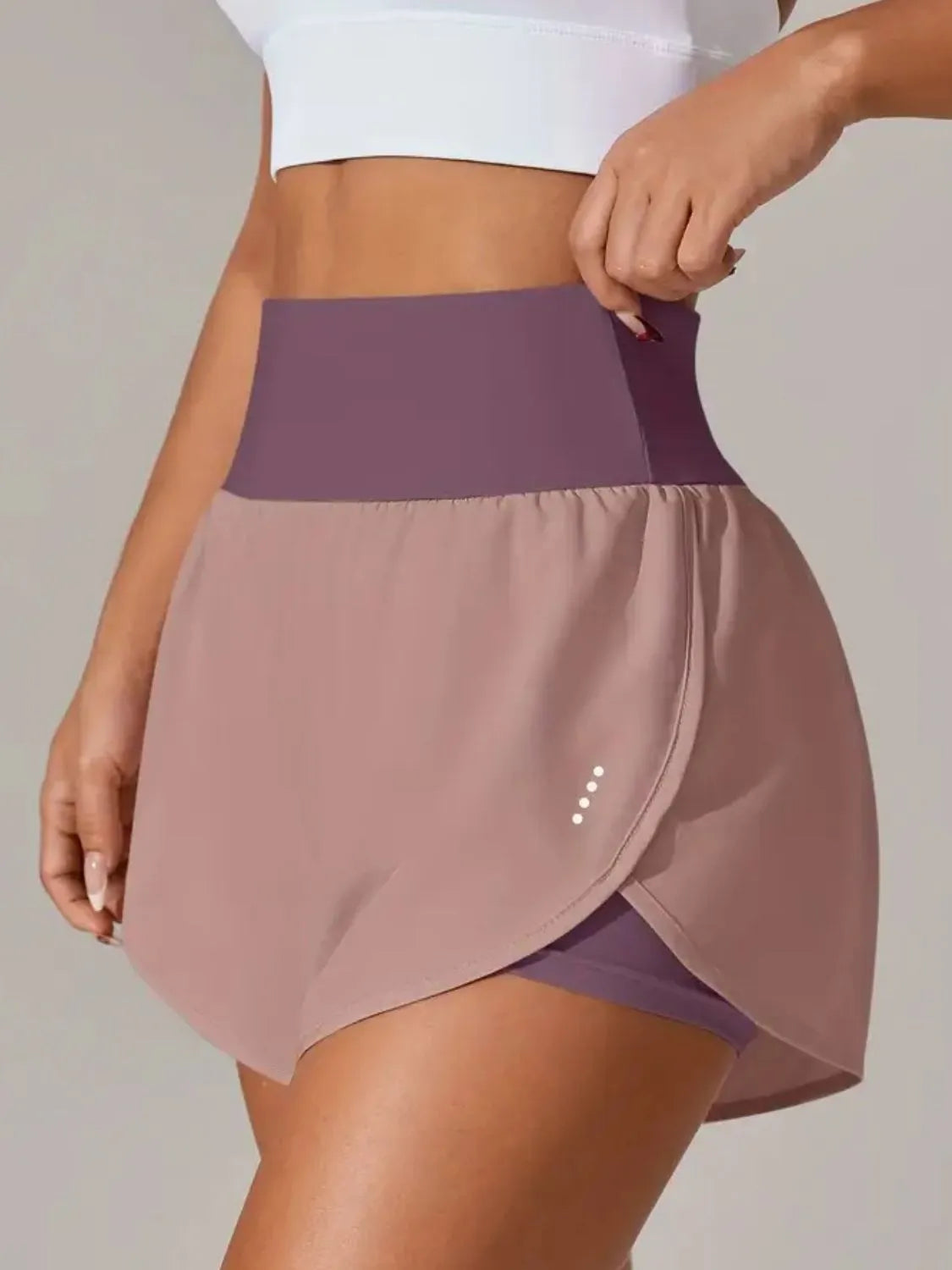 Lavender wrap-overlay shorts shown from behind