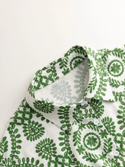 Women's printed tie-waist button-front romper, close-up of green print