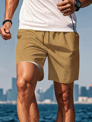 Side view of mustard drawstring shorts on a model