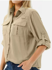 Khaki beige button-down shirt, close three-quarter view showing chest pockets