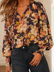 Women's floral V-neck puff-sleeve blouse, model front view