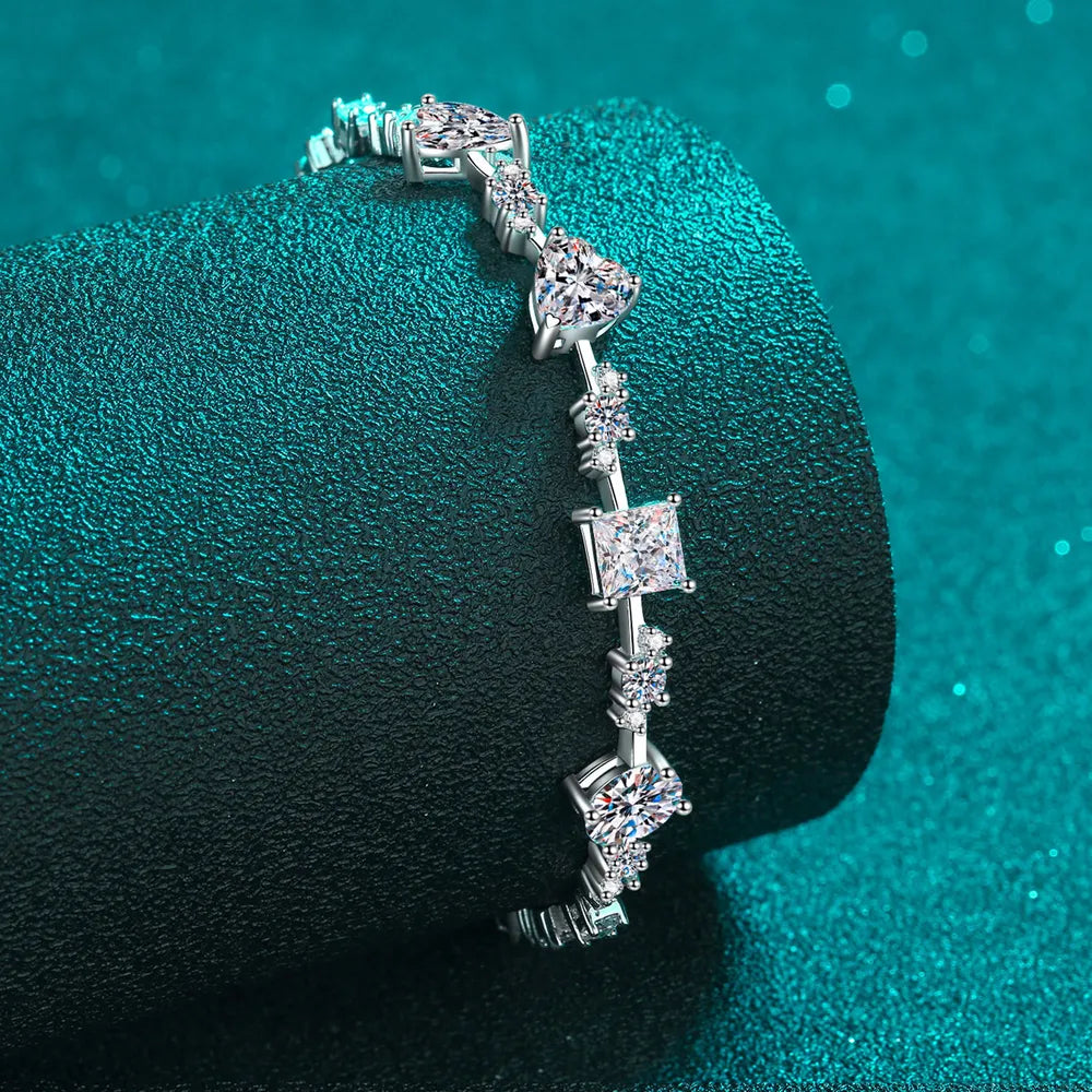Close-up of square and round stones on silver bracelet