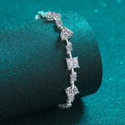 Close-up of square and round stones on silver bracelet