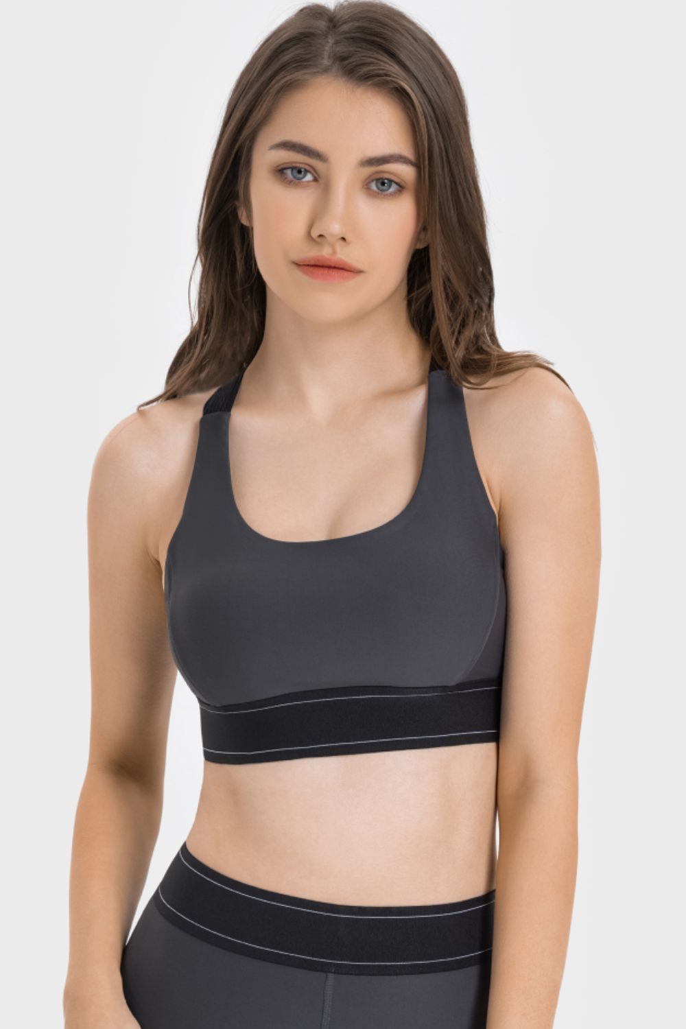 Front view of charcoal contrast sports bra with wide black hem band