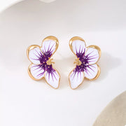 Pair of purple-and-white flower stud earrings, front view