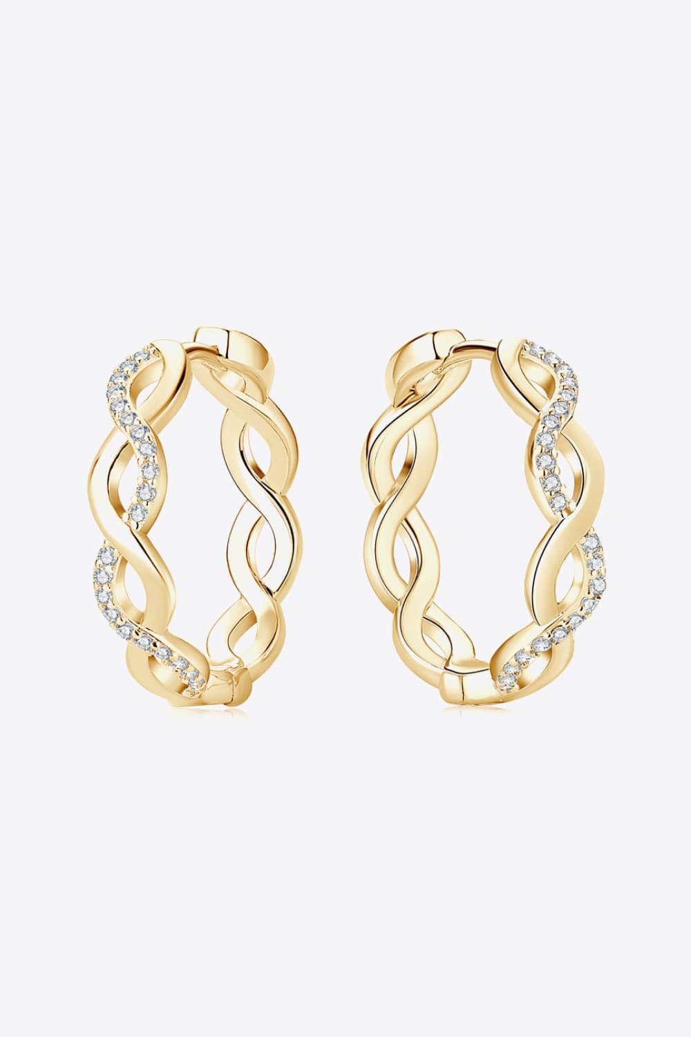 Pair of gold-tone crisscross hoops viewed from the side