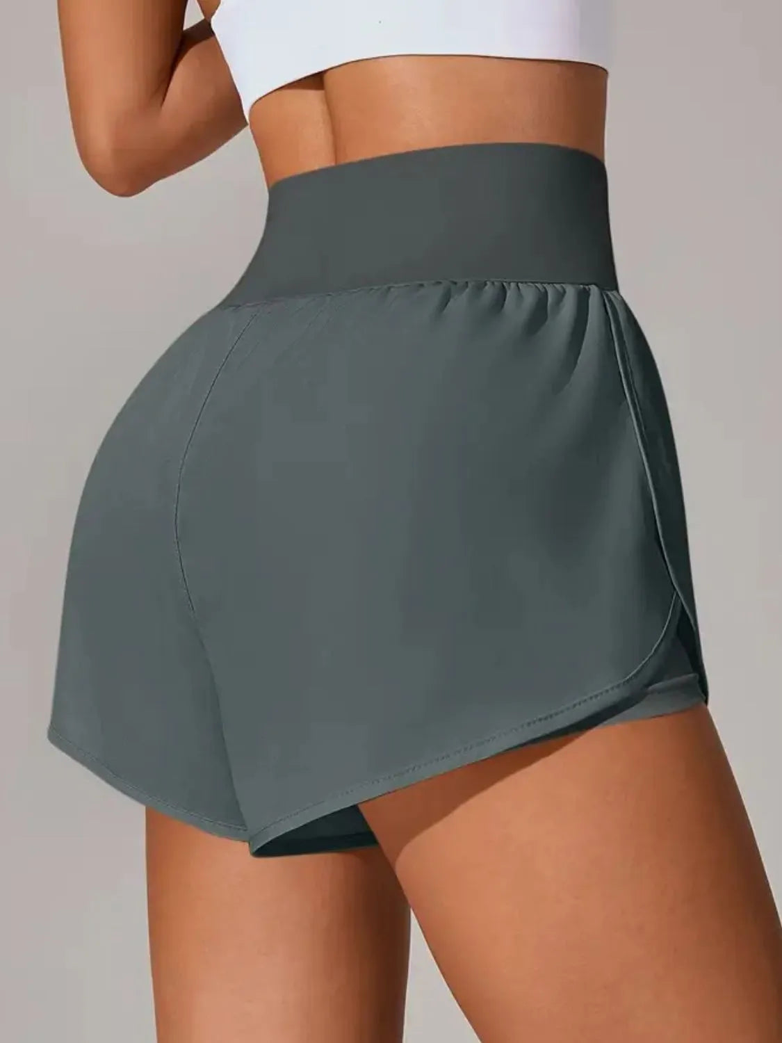 Back side view of charcoal-gray high-waisted wrap-overlay shorts