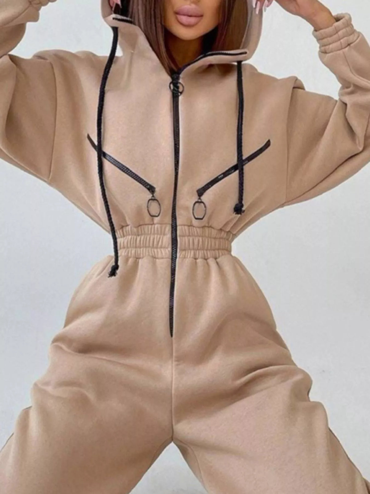 Women's beige hooded jumpsuit, close-up of front pockets and waist