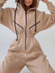 Women's beige hooded jumpsuit, close-up of front pockets and waist