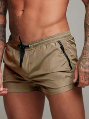 Model wearing tan drawstring active shorts