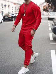 Model wearing red long-sleeve top and jogger pants set