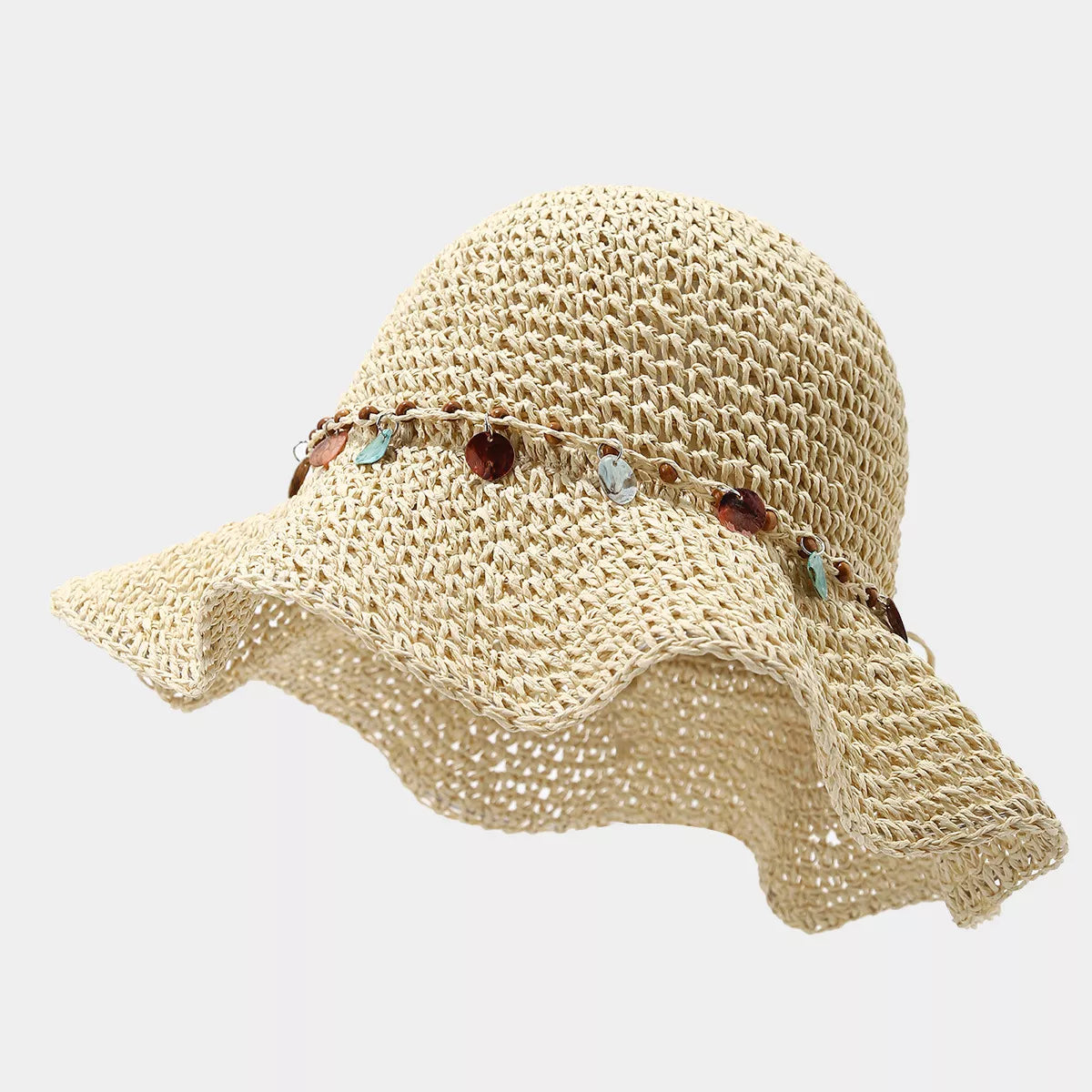 Beige straw-woven sun hat with wavy brim and colorful disc trim