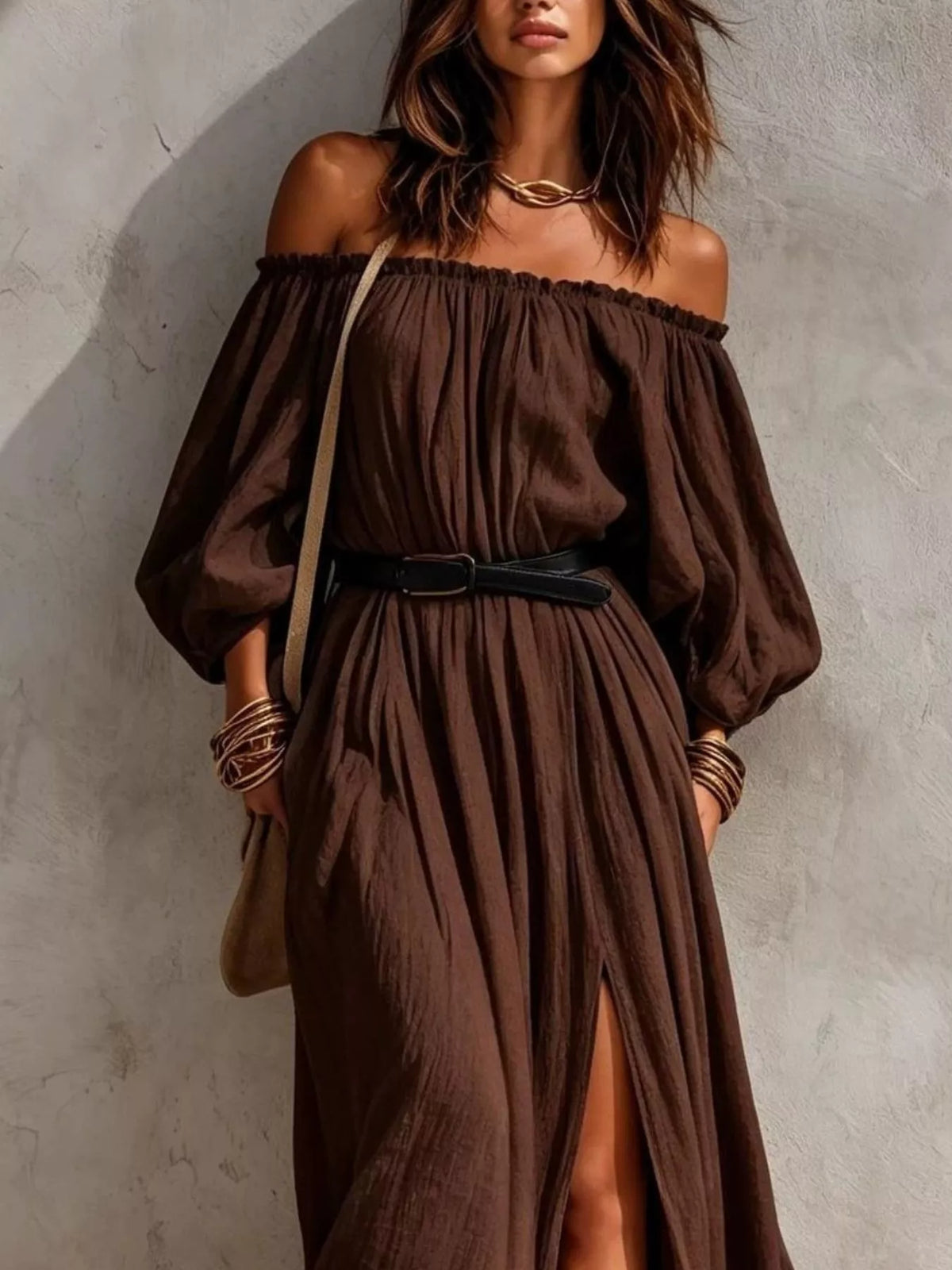 Front view of dark brown off-shoulder maxi dress with belted waist