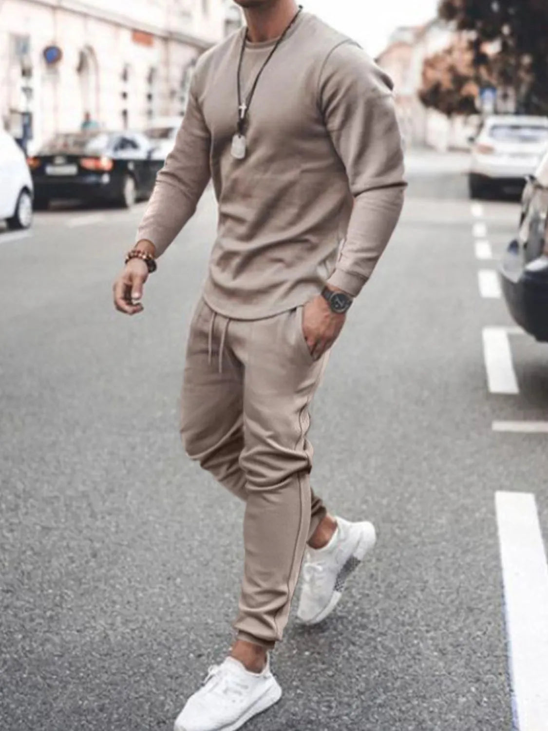 Model wearing taupe long-sleeve top and jogger pants set
