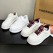 White platform sneakers with burgundy laces alongside white pair