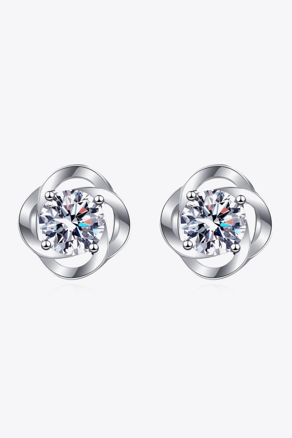 Front view of clear-stone stud earrings with rounded silver-tone surrounds
