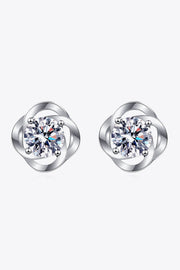 Front view of clear-stone stud earrings with rounded silver-tone surrounds