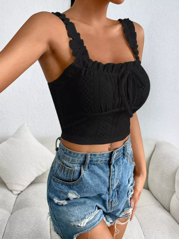 Side view of black eyelet crop top with ruffle straps