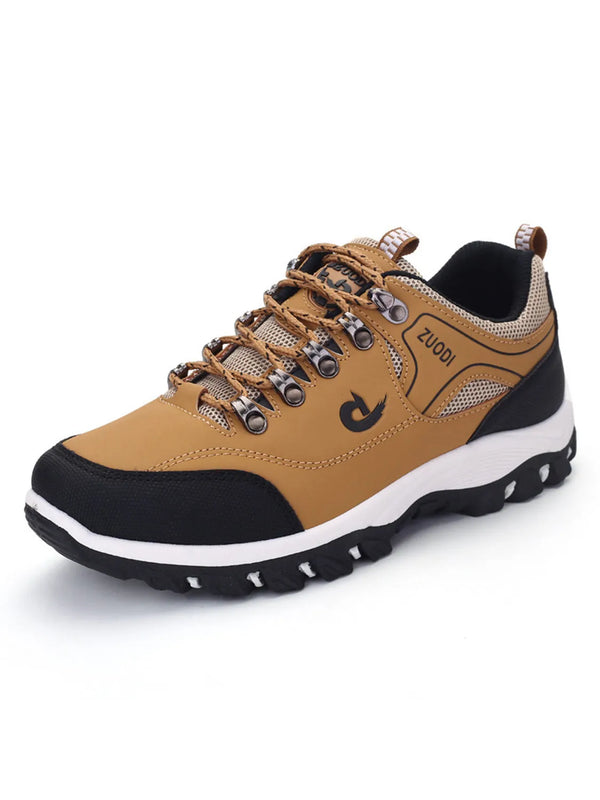 Tan and black lace-up shoe with mesh panels and metal lace hooks, product view