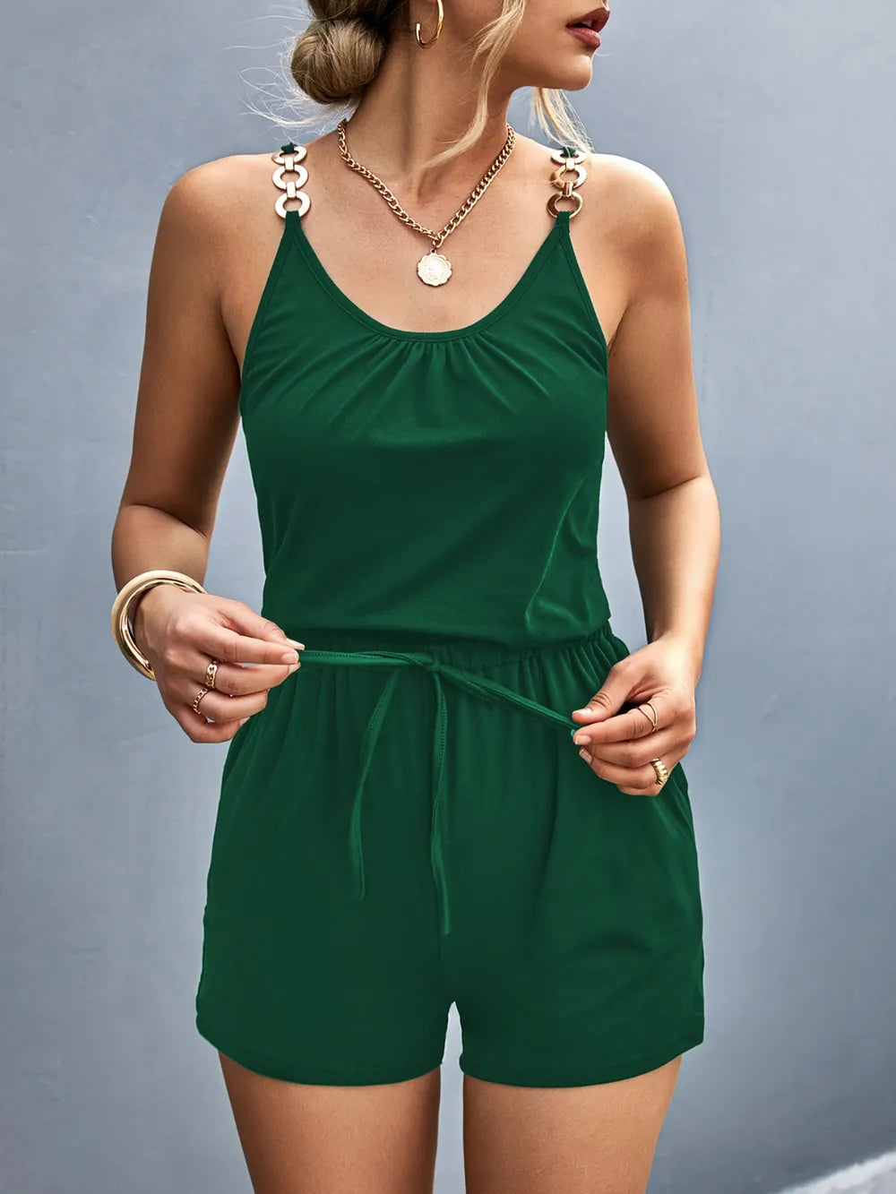 Close view of green romper front and neckline