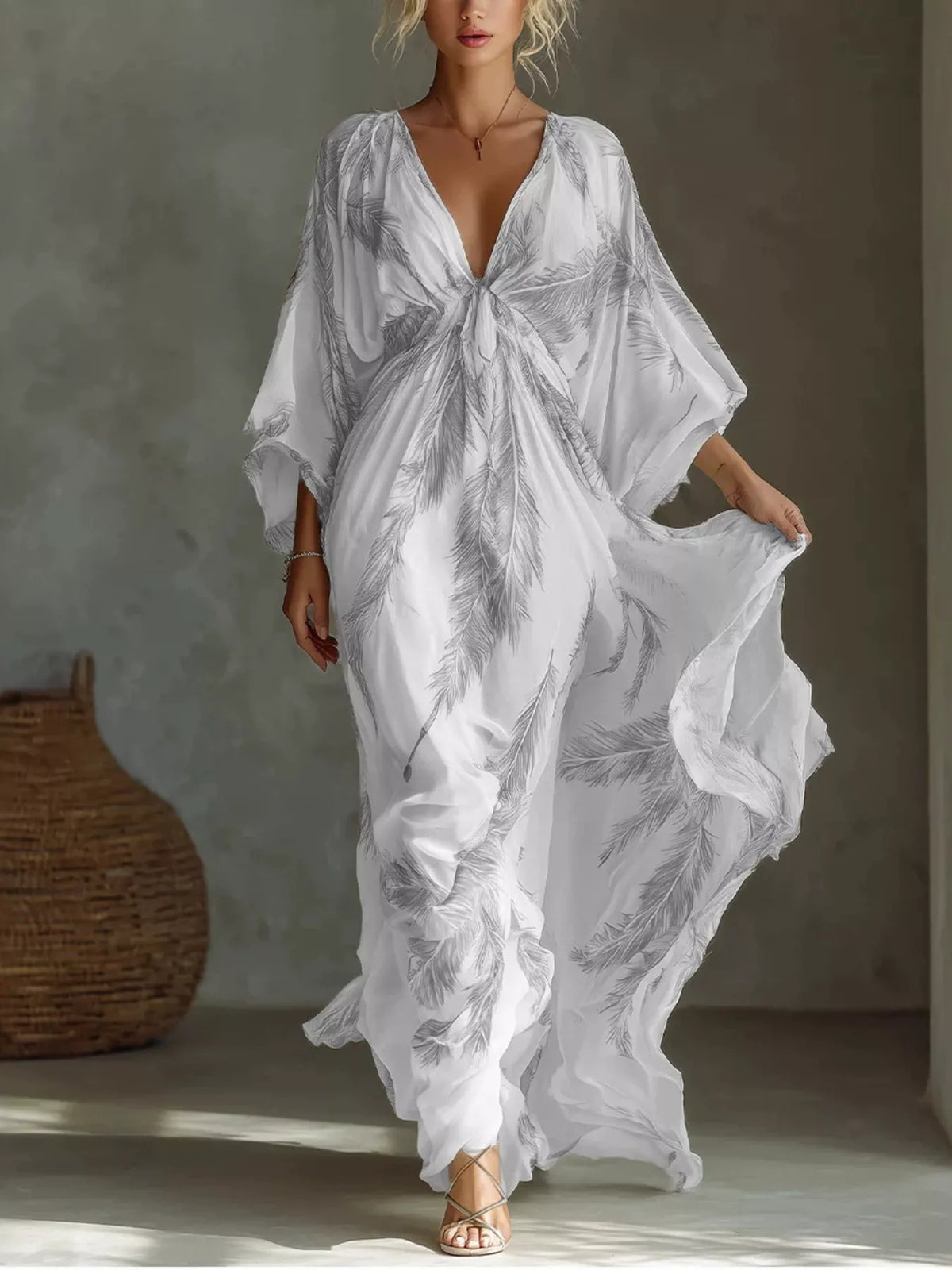 White and grey feather-print maxi dress with a tied V-neckline and loose sleeves, full front view.