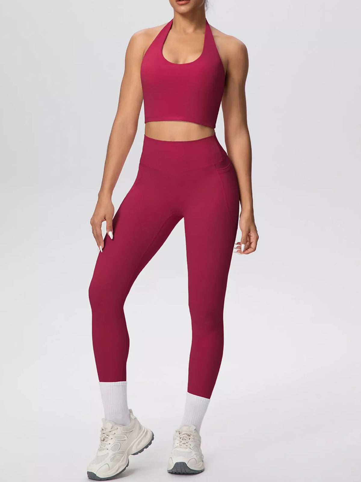 Front view of pink halter-neck crop top and leggings