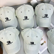Light blue denim baseball cap shown from the front