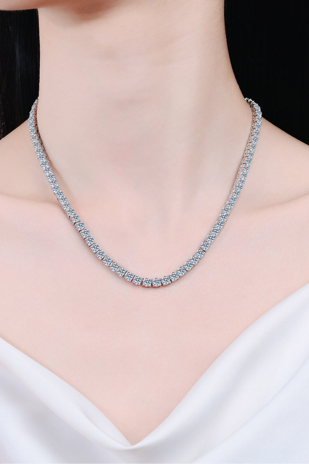 Fine silver-tone moissanite necklace worn at the neckline