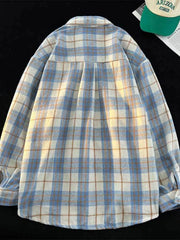 Men's oversized plaid shirt displayed from the back, showing the checked pattern across the yoke and sleeves