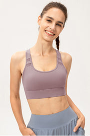 Mauve scoop-neck sports bra shown from the front