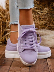 Pair of lavender platform sneakers viewed from front