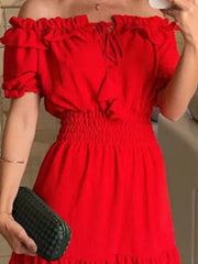 Close-up of red off-shoulder ruffled neckline and smocked bodice