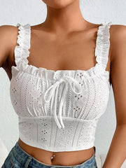 Close-up front view of white eyelet tie-front tank and ruffled straps
