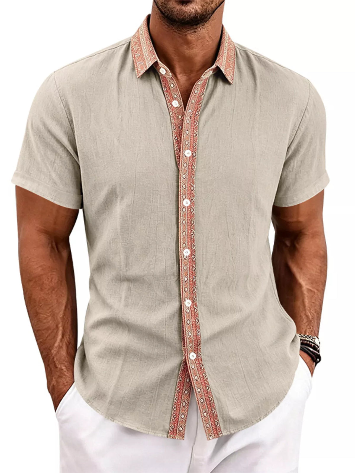 Model wearing beige short-sleeve shirt with rust patterned collar and button placket