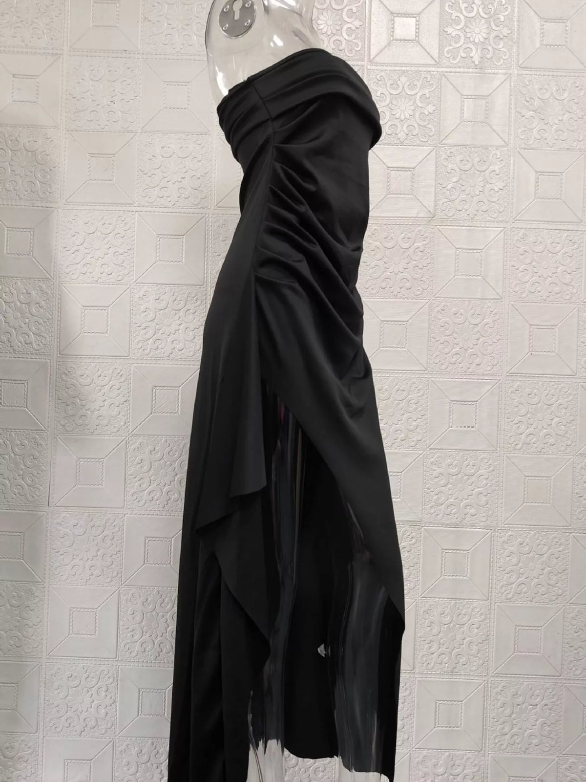 Black maxi dress showing ruched side drape