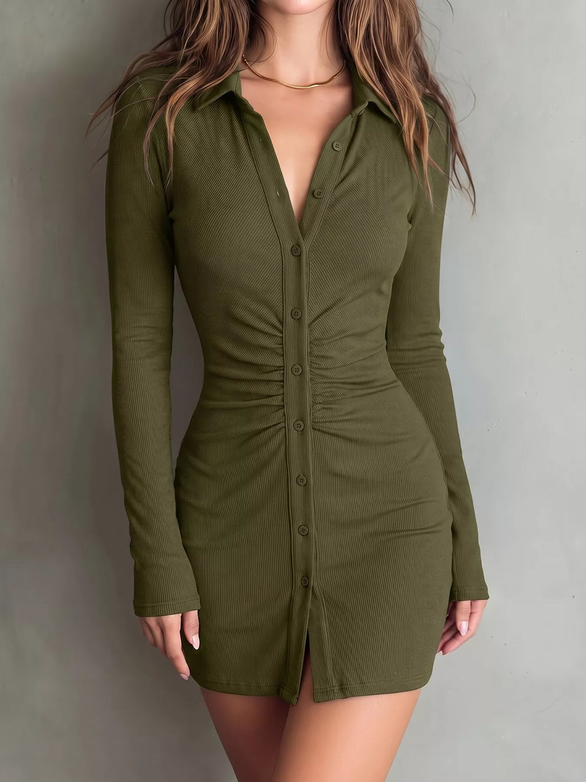 Model poses in olive ruched button-front dress, showing its fitted shape.