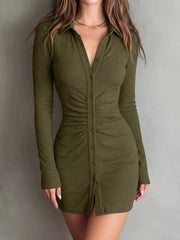 Model poses in olive ruched button-front dress, showing its fitted shape.