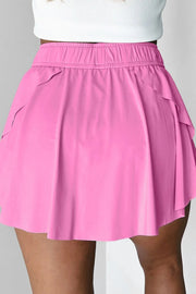 Close-up of pink skort waistband and long drawstring tie.