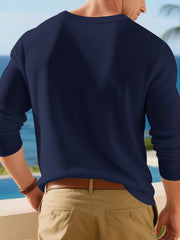 Close view of the gray shirt front and short button placket.