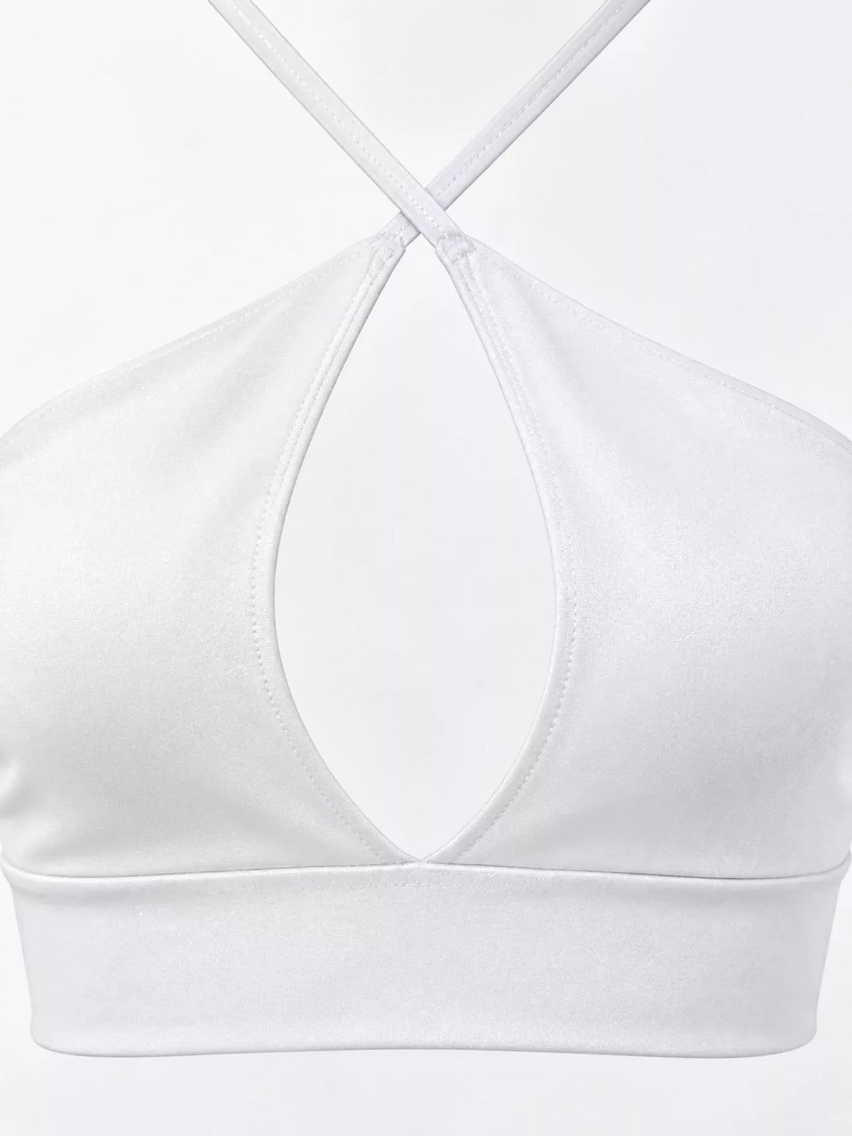 Close-up of white halter crop cami front neckline and cutout