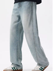 Side view of light blue loose-fit jeans worn with sneakers