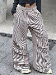 Close view of striped pants waist and loose wide-leg fit