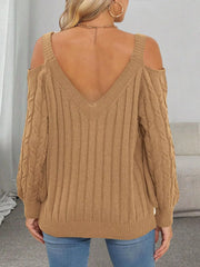 Back view of tan cable-knit sweater with V neckline and open shoulders