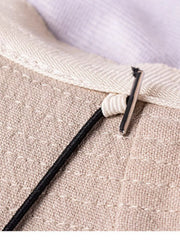 Close-up of khaki hat chin cord and adjustable toggle