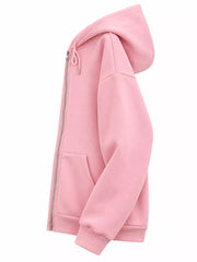 Side view of the pink hoodie showing its hood and relaxed sleeve shape