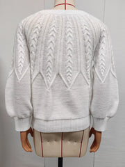 Back of white cable-knit sweater displayed on a mannequin